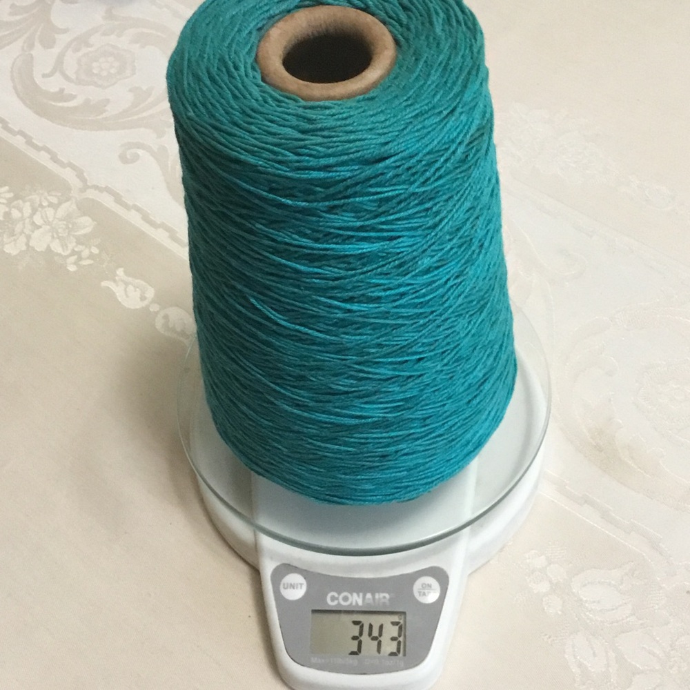 Cone of Baby Georgia mercerized cottage yarn.  Turquoise- Mer du Sud